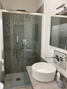 a bathroom with a shower with a sink and a tub at Casa Wanda - Restyled 2026 Edition Holiday Home, Ischia Center in Ischia Town +34 photos