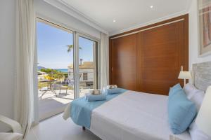 a bedroom with a bed and a large window at Villa Cel in Muro