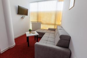 Χώρος καθιστικού στο Apartmani i sobe Castra