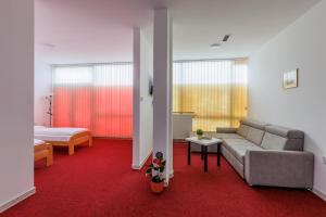 Ένα ή περισσότερα κρεβάτια σε δωμάτιο στο Apartmani i sobe Castra