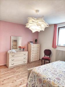 Postel nebo postele na pokoji v ubytování Casa Pepolina, zona tranquilla, piano terra con parcheggio