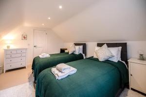 Llit o llits en una habitació de Clare Cottage