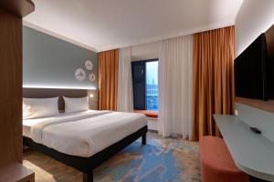 Postel nebo postele na pokoji v ubytování ibis Styles Kiel City