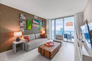 a living room with a couch and a table at Stunning Condo 2/2 At Hyde BeachResort Beach Front in Hollywood