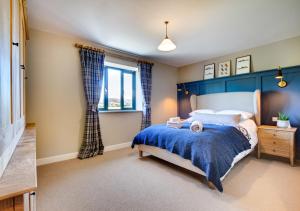 a bedroom with a bed and a window at Rocks Cottage in Builth Wells