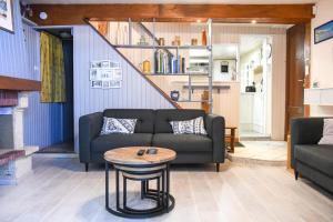 Posedenie v ubytovaní Le Cabanon - Maison 2 ch avec jardin et parking