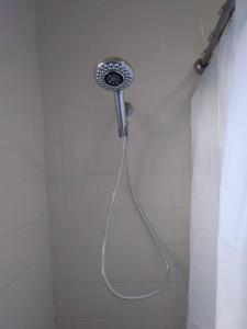 a shower with a shower head in a bathroom at Bungalow Haven in Winter Haven