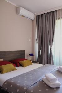 Diva Petra Apartment tesisinde bir odada yatak veya yataklar