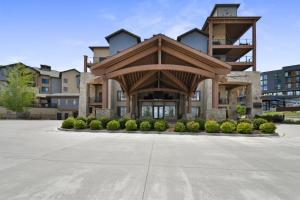 a large apartment building with a wooden roof at Silverado Lodge by Park City - Canyons Village in Park City