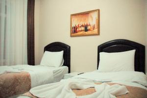 Postel nebo postele na pokoji v ubytování Tolga Hotel