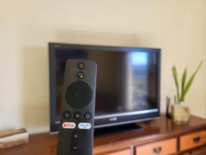 TV a/nebo společenská místnost v ubytování Apartment next to Ajabo Beach Pool & Ocean view