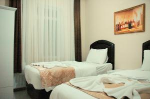 Postel nebo postele na pokoji v ubytování Tolga Hotel