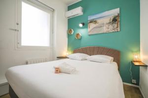 Posteľ alebo postele v izbe v ubytovaní Vieux-Port - Vue exceptionnelle - 3 ch et clim