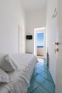 Cama ou camas em um quarto em Albergo La Prora