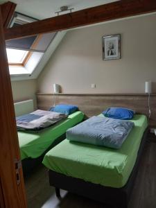 Posteľ alebo postele v izbe v ubytovaní Ter Ename n°1