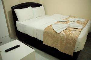 Postel nebo postele na pokoji v ubytování Tolga Hotel