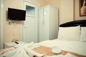 Postel nebo postele na pokoji v ubytování Tolga Hotel