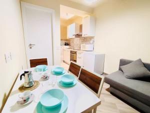 a living room with a table with blue dishes on it at Casa Bella The First in Riomaggiore
