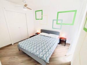 a bedroom with a bed and two lights on two tables at Casa Bella The First in Riomaggiore