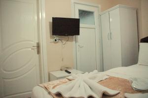 Postel nebo postele na pokoji v ubytování Tolga Hotel