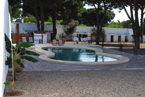 Piscina de la sau aproape de CÁDIZ - GANESHA acogedor apartamento en Chiclana de la Frontera, España