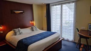 Postel nebo postele na pokoji v ubytování Hotel Le Marin