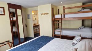 Postel nebo postele na pokoji v ubytování Hotel Le Marin