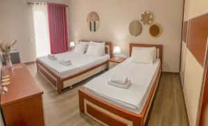 Postel nebo postele na pokoji v ubytování Aljur Hotel