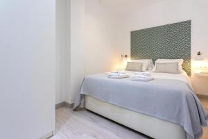 Posteľ alebo postele v izbe v ubytovaní Livemalaga Pedregalejo