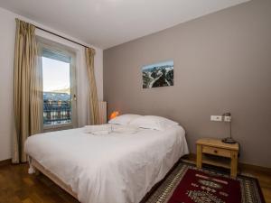 Posteľ alebo postele v izbe v ubytovaní Charmant duplex au cœur de Chamonix avec terrasse, wifi et parking - FR-1-343-183