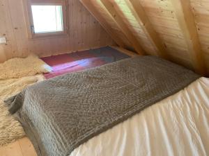 Łóżko lub łóżka w pokoju w obiekcie Le Bel appartement de Montagne