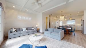 a living room with two couches and a table at Dorado Dunes #D Newly Built, Gorgeous Beach Home, Private Pool, Golf Cart Entire Stay in Port Aransas