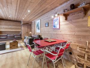 a dining room with a red table and chairs at Appartement Val-d'Isère, 2 pièces, 4 personnes - FR-1-694-80 in Val-d'Isère
