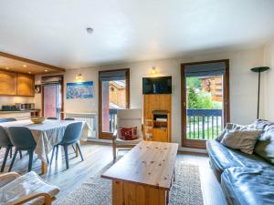 a living room with a couch and a table at Appartement Val-d'Isère, 4 pièces, 6 personnes - FR-1-694-235 in Val-d'Isère