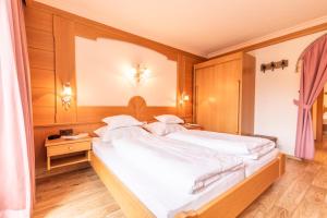 Postelja oz. postelje v sobi nastanitve Hotel Garni Apart TINA
