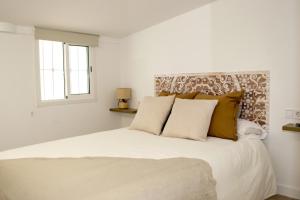 Postel nebo postele na pokoji v ubytování A&C Casa playa Torre del mar-Málaga + 20 fotografií