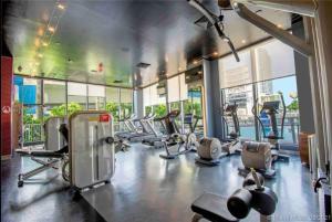 a gym with several treadmills and elliptical machines at Miami Intercoastal Beach Studio Apmt 2QB 1B in Hallandale Beach