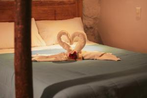Postel nebo postele na pokoji v ubytování Cochito Cusco