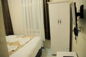 Postel nebo postele na pokoji v ubytování Tolga Hotel