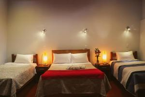 Postel nebo postele na pokoji v ubytování Cochito Cusco