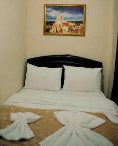 Postel nebo postele na pokoji v ubytování Tolga Hotel