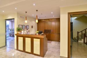 a hotel lobby with a reception desk in a building at Filoxenia Hotel in Ioannina