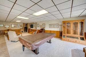 a large room with a ping pong table in it at Spacious Plymouth Hideaway on Acreage with Lake! in Plymouth