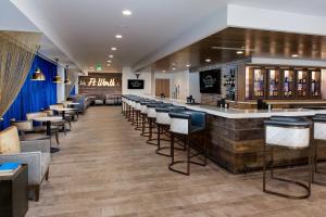 a bar in a restaurant with stools at Fairfield Inn & Suites Fort Worth Downtown/Convention Center in Fort Worth