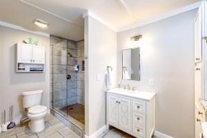 a bathroom with a toilet sink and a shower at 7213 Flood Reef - Unit 2 in Pensacola