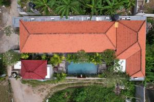 an overhead view of a house with an orange roof at Pattri Dihati Lembongan in Nusa Lembongan