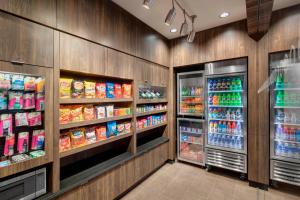 a grocery store aisle with a refrigerator and lots of food at Fairfield Inn and Suites Chicago Downtown/ Magnificent Mile in Chicago