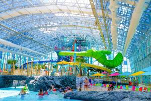 a water park with people playing in the water at TownePlace Suites by Marriott Foley at OWA in Foley