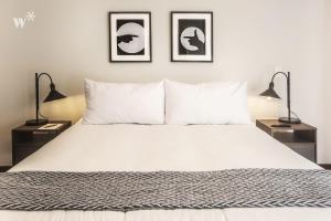 Cama ou camas em um quarto em Las Mimosas by Wynwood House