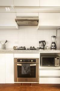 A cozinha ou cozinha compacta de Las Mimosas by Wynwood House